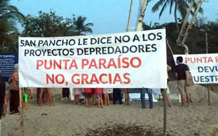 A sign in San Pancho: 'San Pancho says no to predatory projects.'