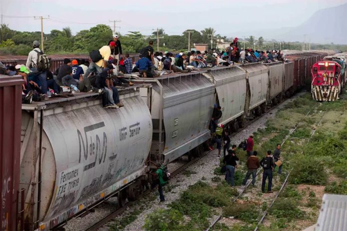 Migrants aboard the freight train nicknamed 'The Beast.'