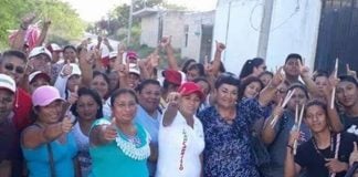 Candidate Magaña, center and wearing red hat, was attacked on Saturday.
