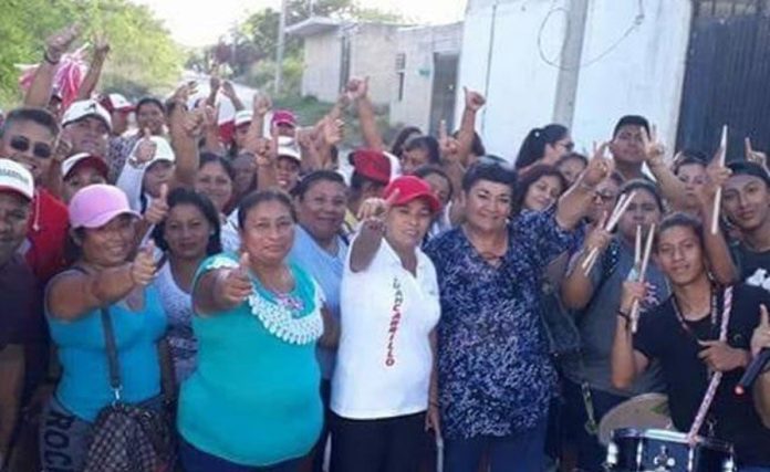 Candidate Magaña, center and wearing red hat, was attacked on Saturday.