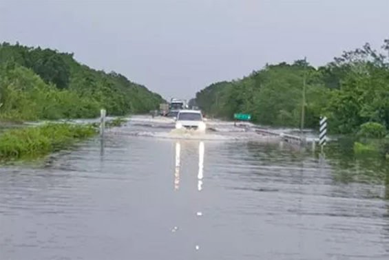 Flooded highway between Felipe Carrillo Puerto and Tulum.