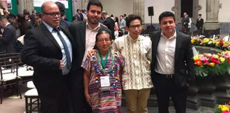 Pablo, with his trademark sandals, and his mother at his graduation.