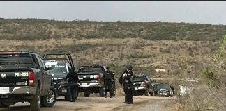 Security forces at the scene of this morning's confrontation.