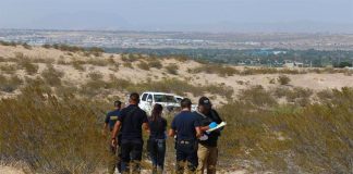 Investigators at one of many crime scenes in Juárez.