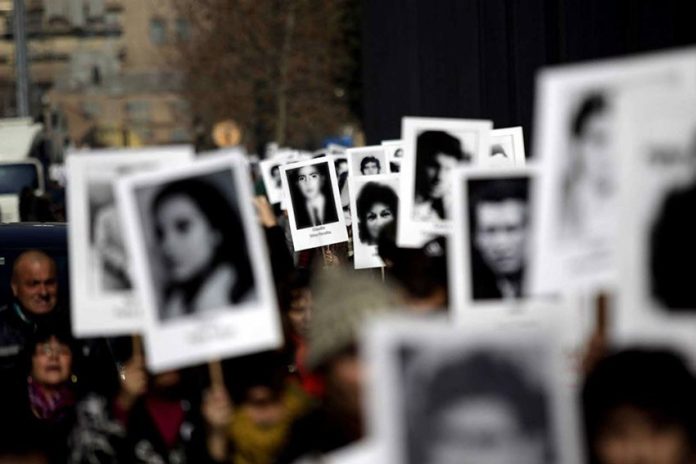 A demonstration by relatives displaying photos of missing family members.