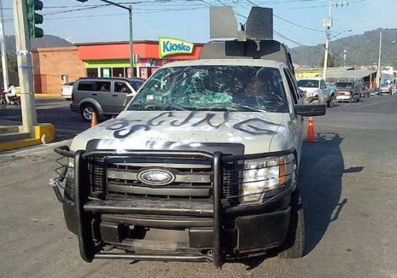 Attackers painted 'CJNG' on hood of navy patrol truck.