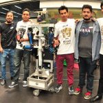UNAM students and their robot, Justina.