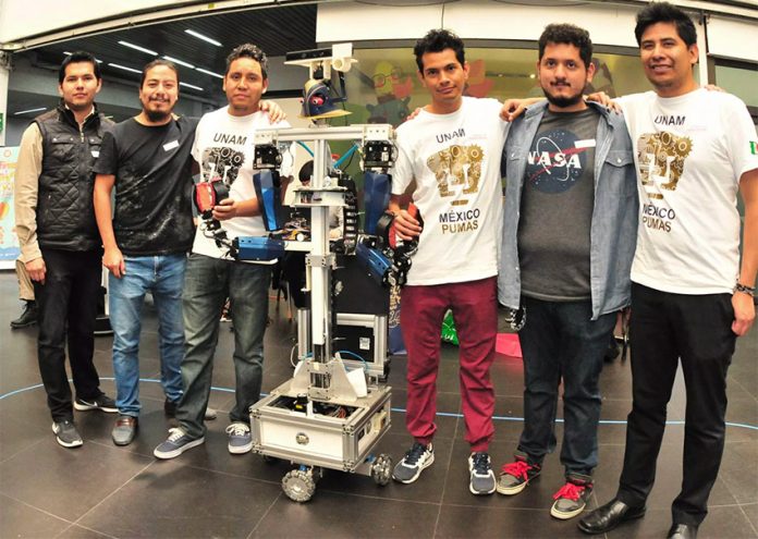 UNAM students and their robot, Justina.