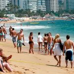 Tourists on an Acapulco beach: their numbers continue to rise.