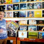 Domene with a collectible Beatles album.