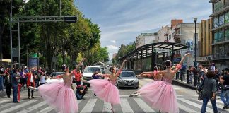 Ballet dancers perform on a Mexico City crosswalk.