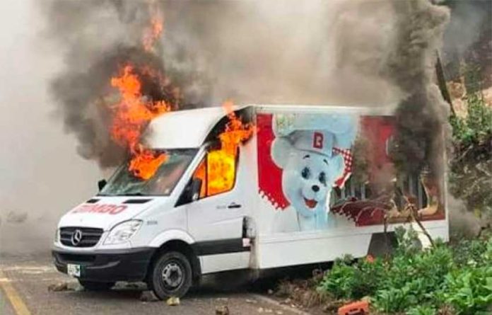 A Bimbo delivery truck burns in Acapulco.