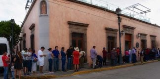 Voters line up at a polling station in Durango on July 1.
