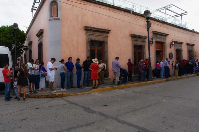 Voters line up at a polling station in Durango on July 1.