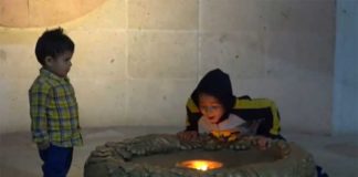 Happy birthday: a boy blows out the eternal flame in Guanajuato.