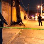 Police at the scene of the funeral vigil.