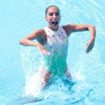 Joana Jiménez beams after her gold-medal performance in synchro swimming.