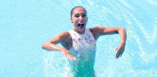 Joana Jiménez beams after her gold-medal performance in synchro swimming.