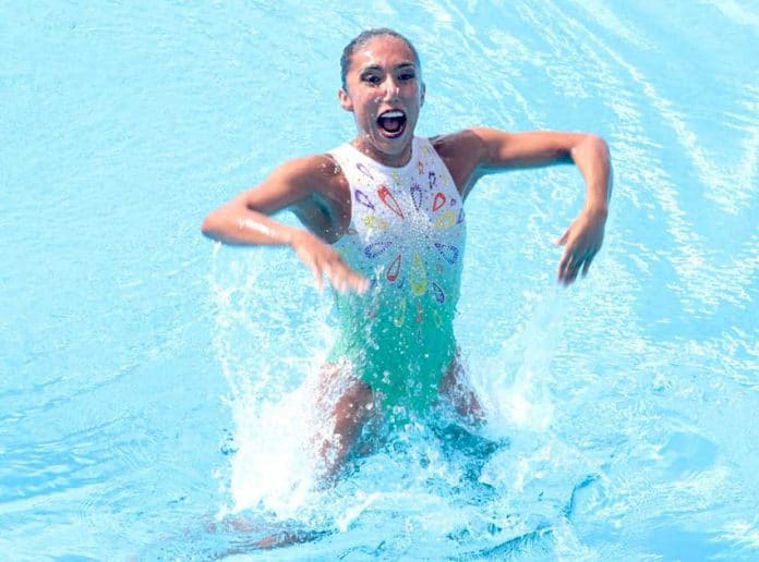Joana Jiménez beams after her gold-medal performance in synchro swimming.