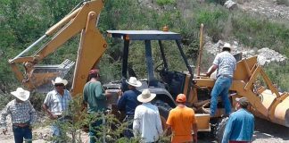 Communal landowners block a road during a protest over the land issue last year.