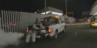 Spraying against mosquitoes at the Guadalajara airport.