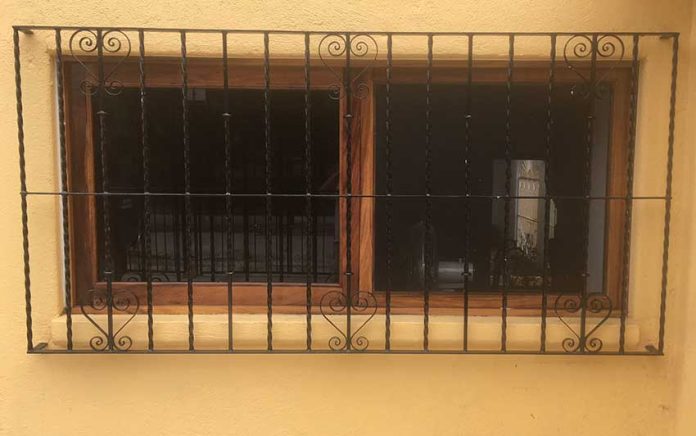 Security bars on a Mexican home. Unlike those in the story, these are mounted outside the frame.