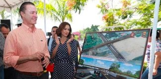 The governor and a sketch of the new overpass.