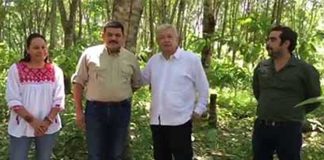 López Obrador, in white shirt, talks about his reforestation plans during a visit to the Lacandon jungle.
