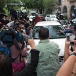 The crowded street outside Morena headquarters.