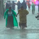 Flooding on the course: Ramírez, left, during some inclement weather at Canyons Ultramarathon.