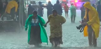 Flooding on the course: Ramírez, left, during some inclement weather at Canyons Ultramarathon.