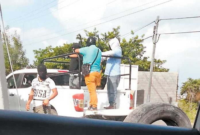 Armed civilians on patrol in Tlayacapan.