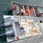 The smugglers' boat, foreground, with its cargo of cocaine and fuel.