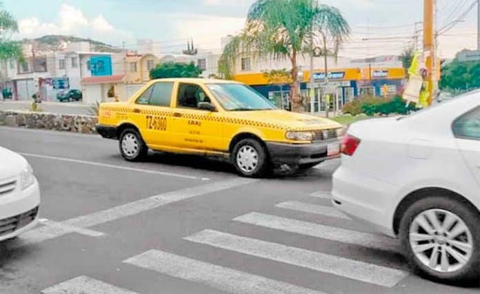A taxi in Querétaro: they may still be yellow but they'll be green too.