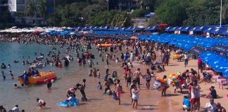 Visitors enjoy an Acapulco beach.