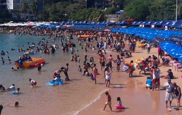 Visitors enjoy an Acapulco beach.