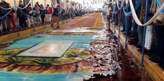 Rain washes away one of Huamantla's colorful carpets.
