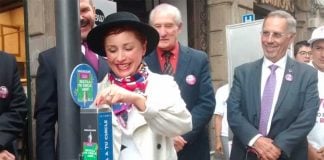 City official María Fernanda Olvera deposits a piece of used gum in one of the new receptacles.
