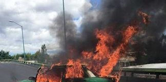 A taxi burns during cartel violence in Jalisco in 2015.
