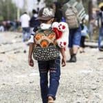 A young migrant, northward bound.