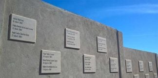 The memorial wall where hundreds of bodies were disposed of.