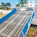 The sargassum removal vessel in dryland storage.