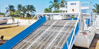 The sargassum removal vessel in dryland storage.