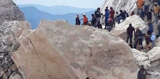 Rescue workers search the slide area in Hidalgo.