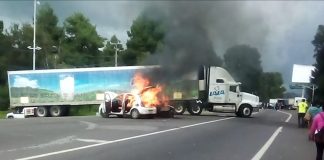 A car burns at a blockade on Wednesday.