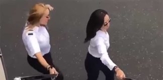 Pilot Manríquez, left, dances alongside her plane.