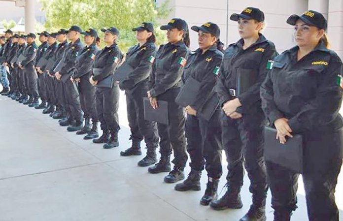 Many women were among the first graduates of new police academy in La Paz.