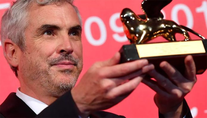 Cuarón and his Venice Film Festival award.