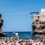 A diver leaves one of the two platforms in Polignano a Mare.