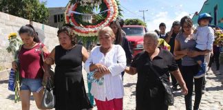 Relatives in the funeral procession for lynching victims.